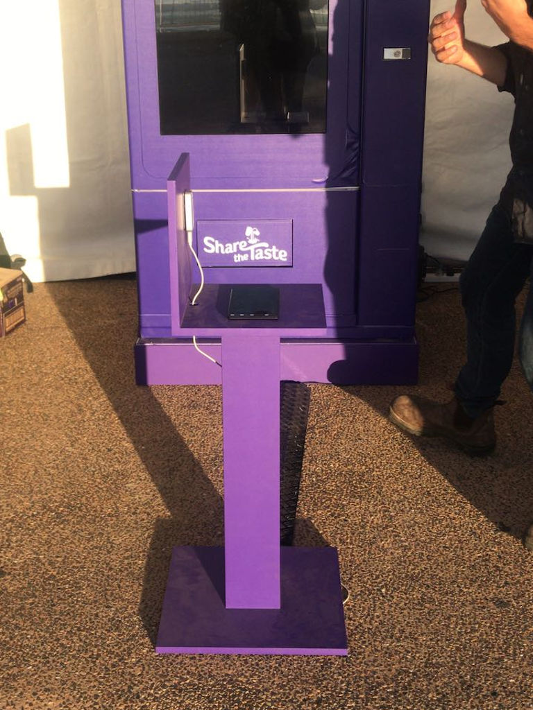 <p>This is the plinth built for the hand sensor. The sensor we used was a Leap Motion mounted vertically and connected via a 5m Active USB3 cable to the PC inside the vending machine. </p><p>The Leap Motion is a commercial stereo IR camera array that has a great software library giving our programmers ability to detect the variety of hand shapes needed during the game, including large and small handsot.</p><p> One problem we uncovered during setup and launch was the cold weather. Our coders hadn't anticipated the variety of clothing that the Players may wear and it had trouble detecting hand shapes with long sleeves. Early in the day, we had to make on-the-fly code adjustments then continue to adjust as the day grew warmer.</p>
